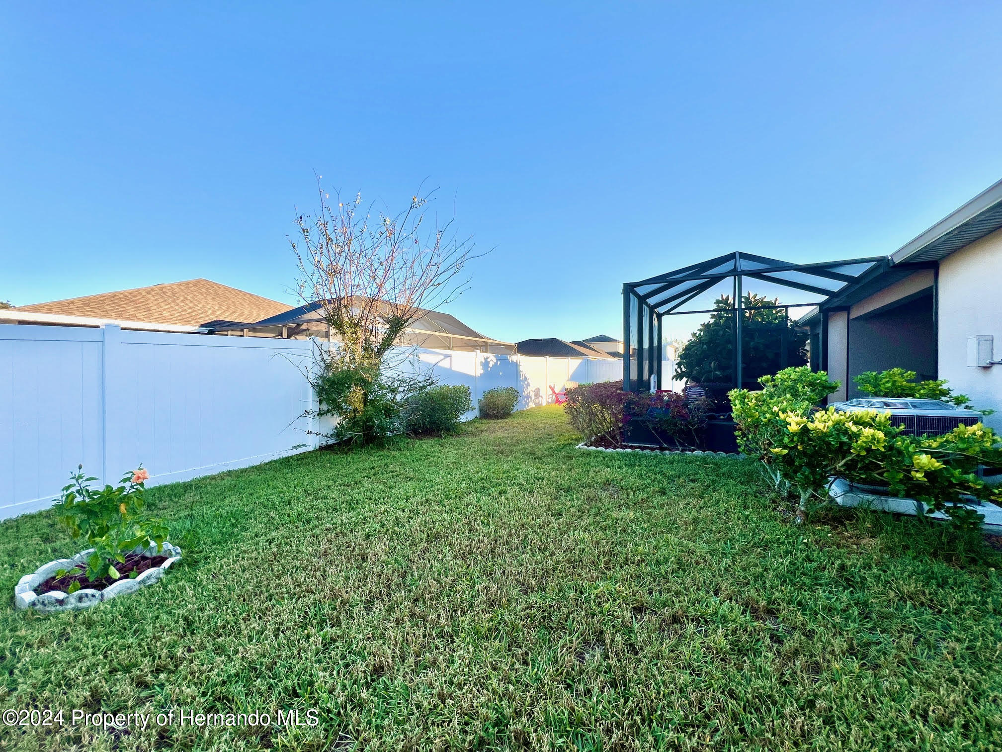 18430 Waydale Loop Hudson, FL 34667 - Photo 29 of 30 a view of a garden in front of a house