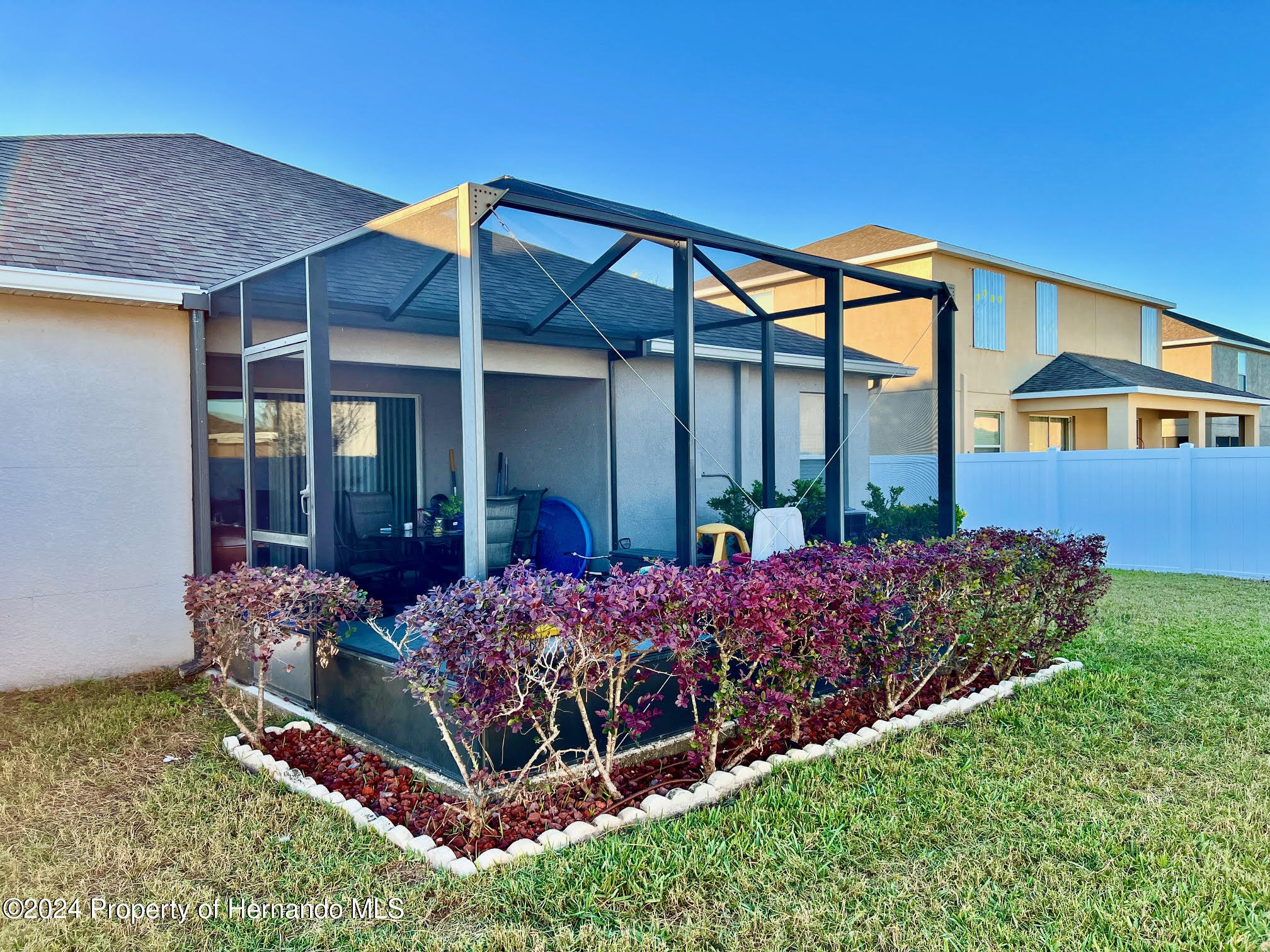 18430 Waydale Loop Hudson, FL 34667 - Photo 30 of 30 a view of a house with porch and garden