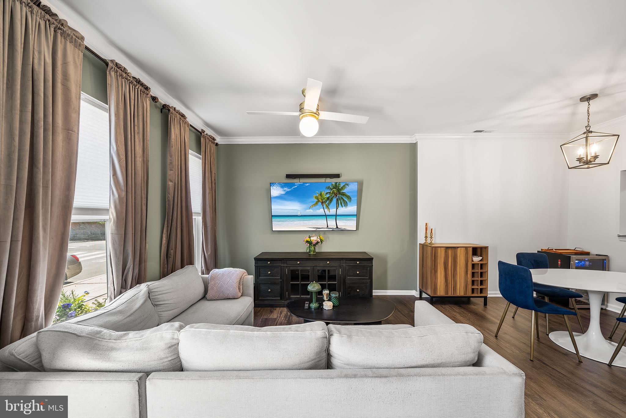 768 South 13th Street Philadelphia, PA 19147 - Photo 1 of 31 a living room with furniture a bed and a chandelier