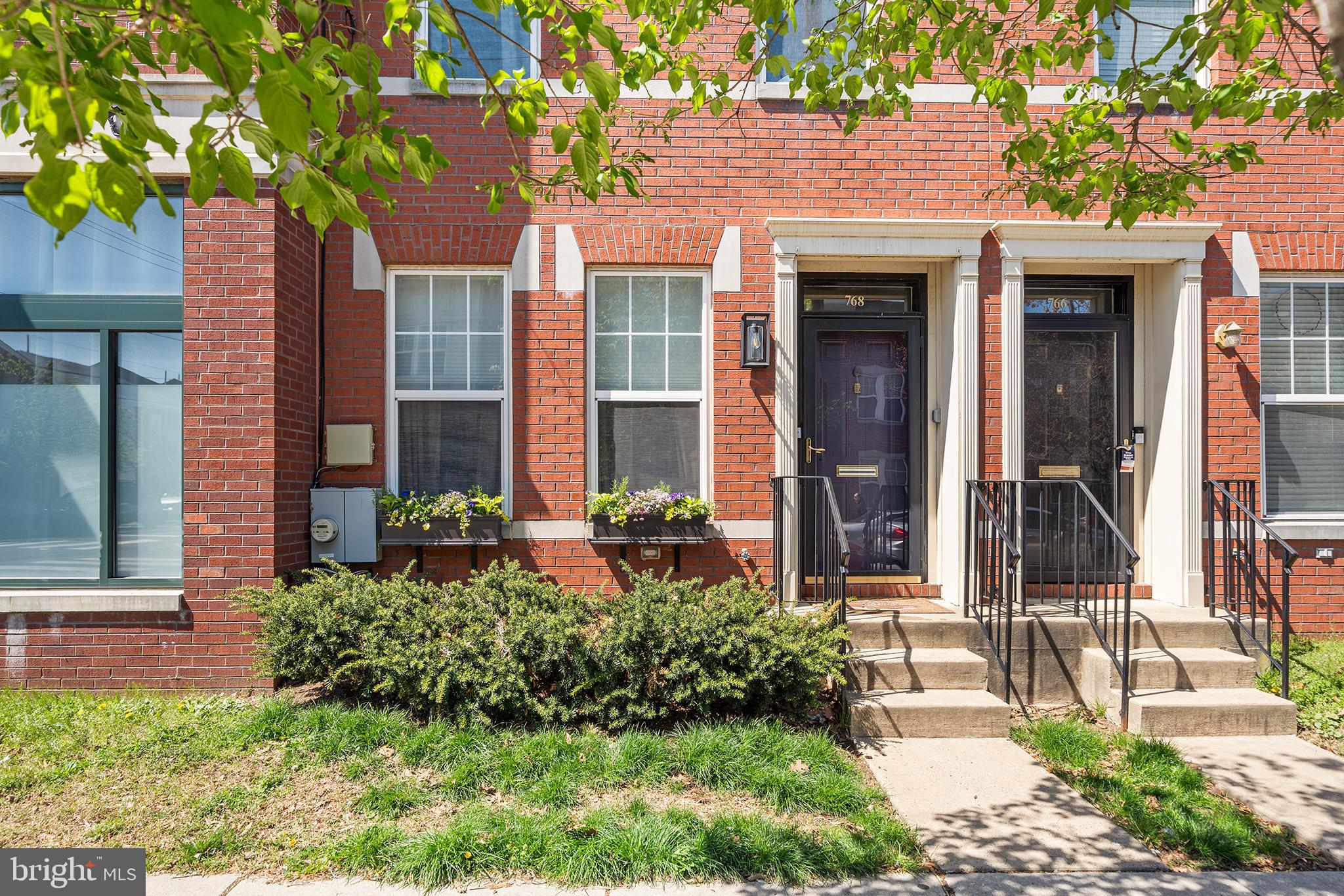 768 South 13th Street Philadelphia, PA 19147 - Photo 2 of 31 a front view of a house with a yard