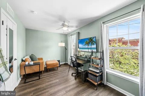 a living room with furniture and a window
