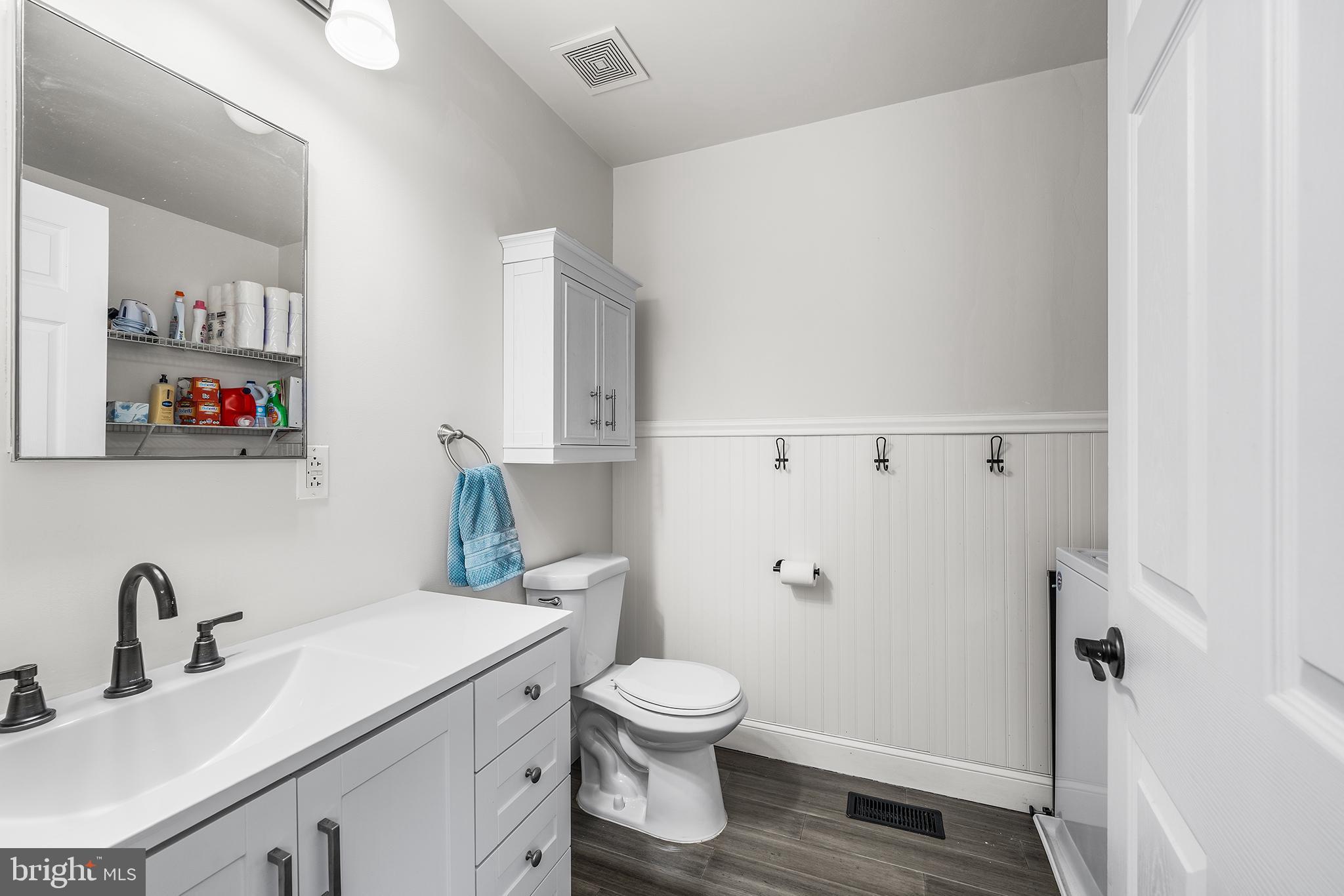 768 South 13th Street Philadelphia, PA 19147 - Photo 26 of 31 a bathroom with a toilet a sink and a mirror