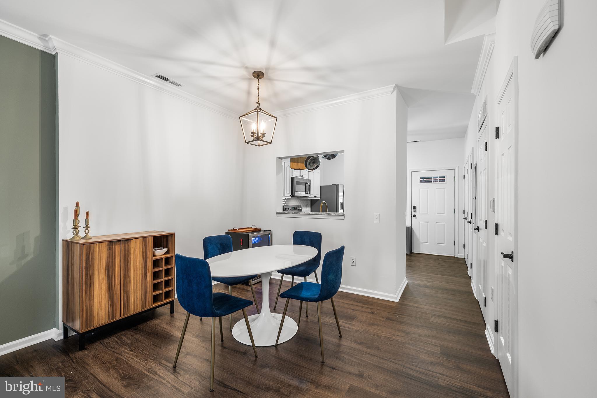 768 South 13th Street Philadelphia, PA 19147 - Photo 4 of 31 a view of a dining room with furniture wooden floor and a chandelier