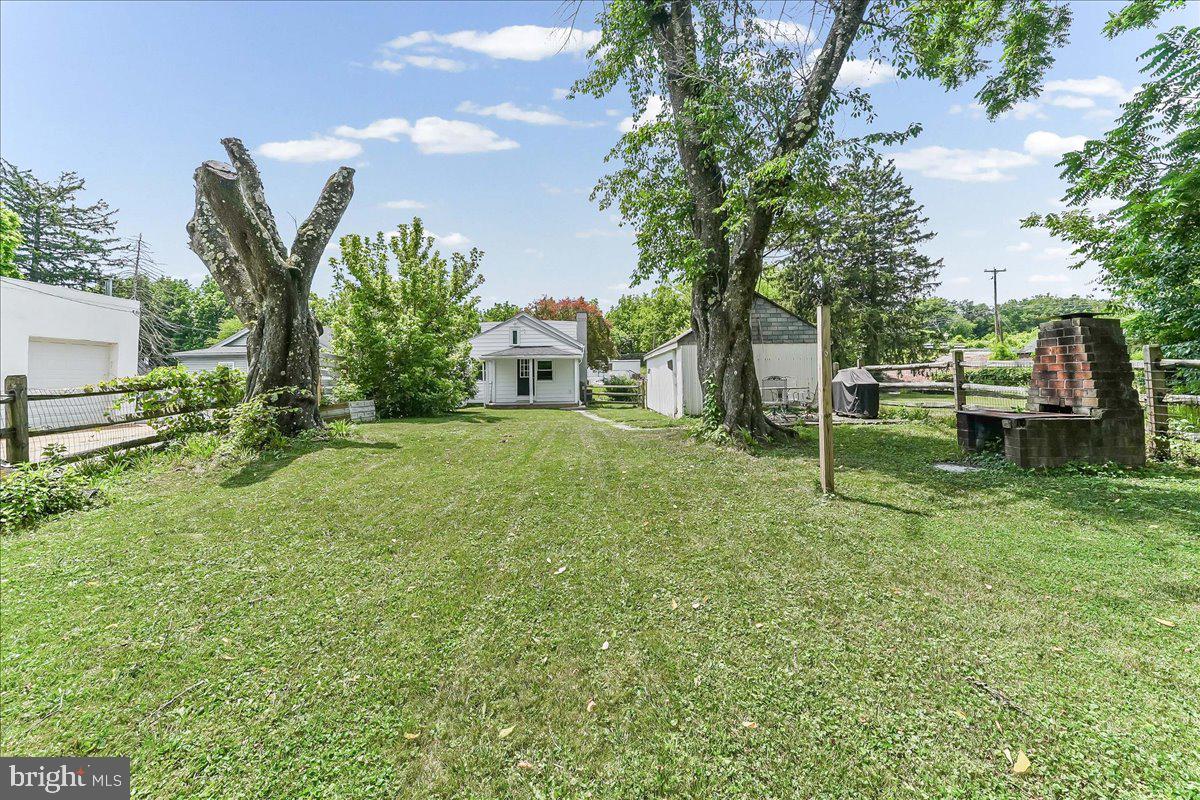 1019 Riverside Drive Pottstown, PA 19465 - Photo 34 of 36 Charming yard with serene greenery.