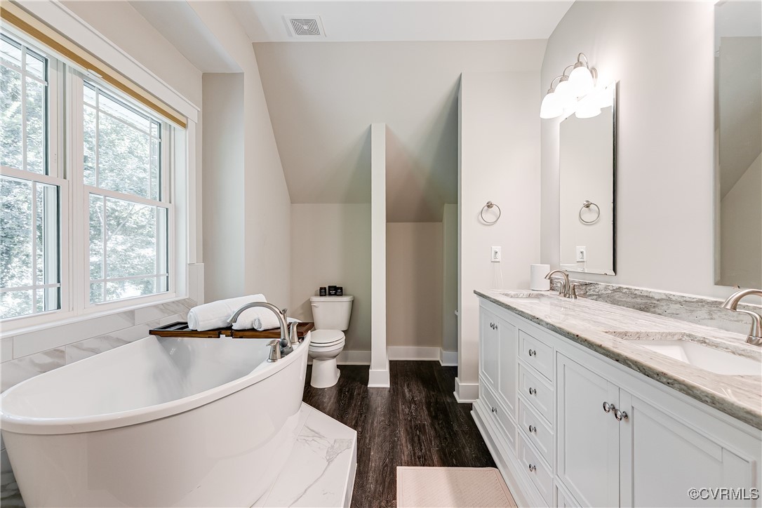 509 Danray Drive Richmond, VA 23227 - Photo 21 of 37 a spacious bathroom with a double vanity sink and a bathtub