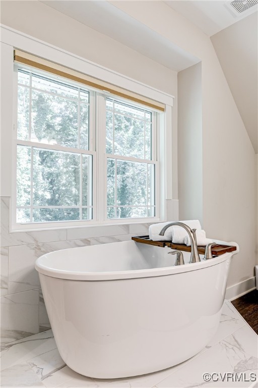 509 Danray Drive Richmond, VA 23227 - Photo 22 of 37 a white bath tub sitting in a bathroom next to a window