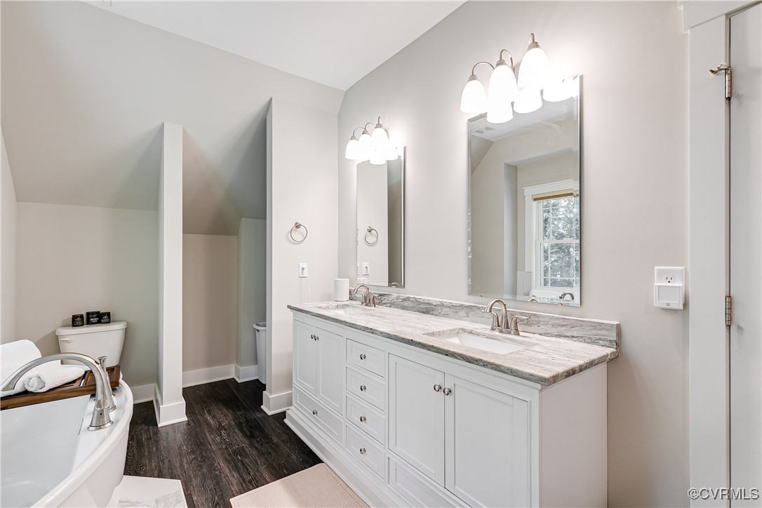509 Danray Drive Richmond, VA 23227 - Photo 23 of 37 a bathroom with a double vanity sink and a mirror