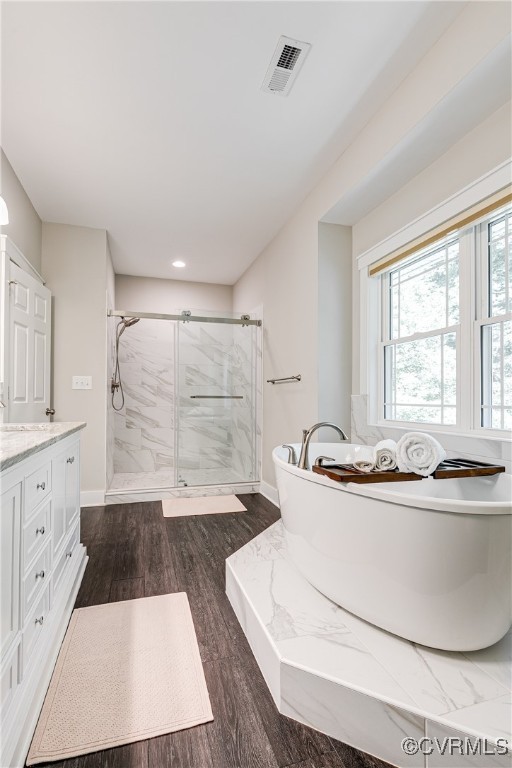 509 Danray Drive Richmond, VA 23227 - Photo 24 of 37 a bathroom with a sink a bathtub a mirror and a shower