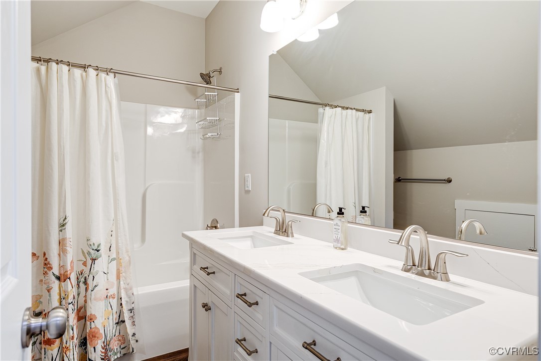 509 Danray Drive Richmond, VA 23227 - Photo 30 of 37 a bathroom with a double vanity sink and a mirror