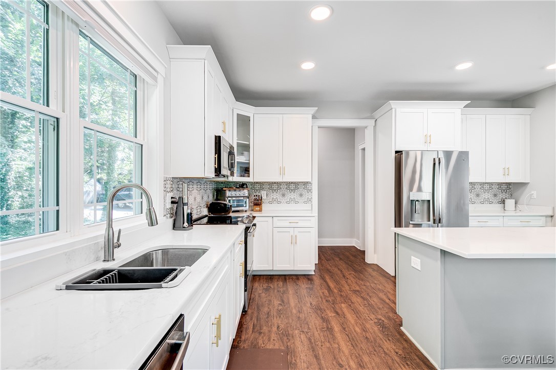 509 Danray Drive Richmond, VA 23227 - Photo 5 of 37 a kitchen with a sink a stove a refrigerator and a stove top oven