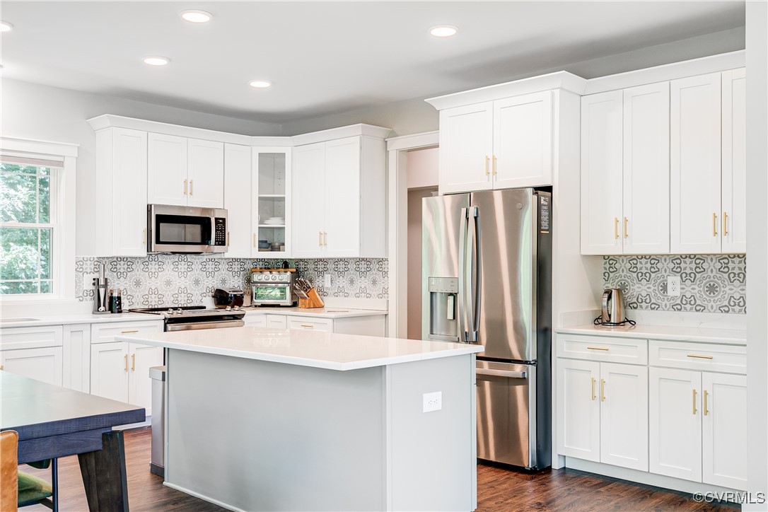 509 Danray Drive Richmond, VA 23227 - Photo 7 of 37 a kitchen with a sink a refrigerator a microwave and cabinets