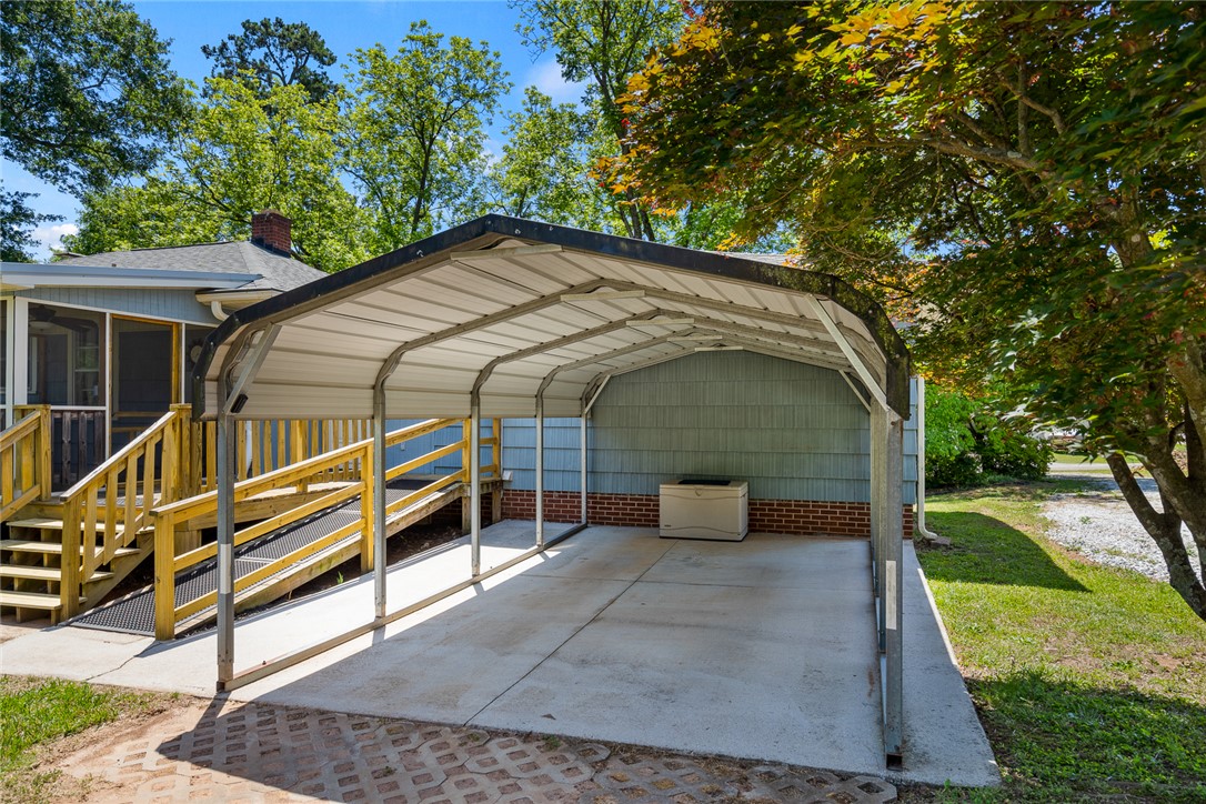 1509 869 Anderson, SC 29621 - Photo 43 of 45 A convenient carport and ramp provide easy access to this home's entrance.