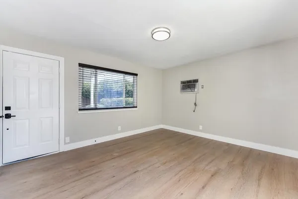 a kitchen with stainless steel appliances kitchen island granite countertop a refrigerator sink and cabinets