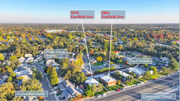 a view of a pathway both side of house