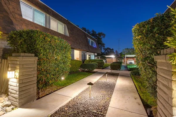 a view of a house with a yard