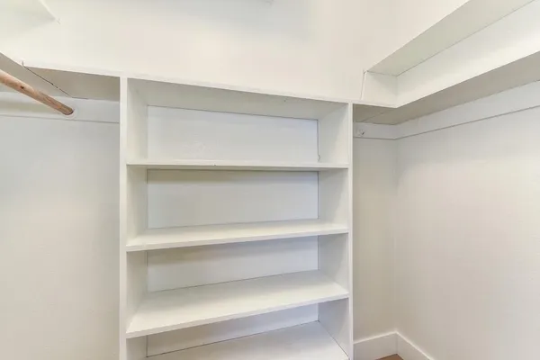 a view of a backyard with wooden fence