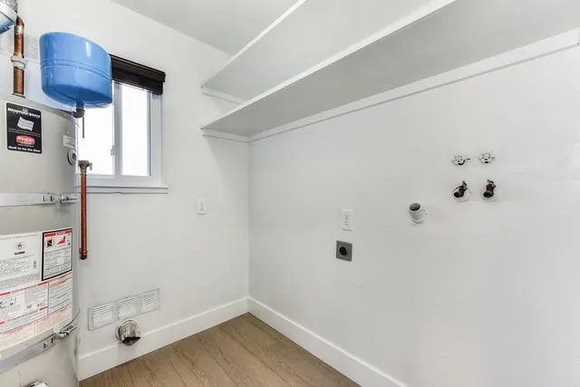 a view of a backyard with wooden fence