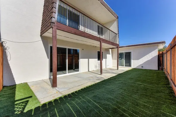 a view of a house with brick walls