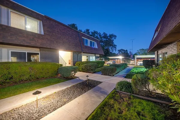 a view of a house with a yard