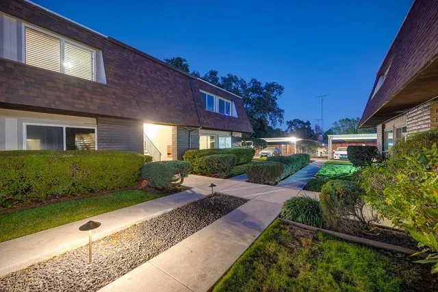 a view of a house with a yard