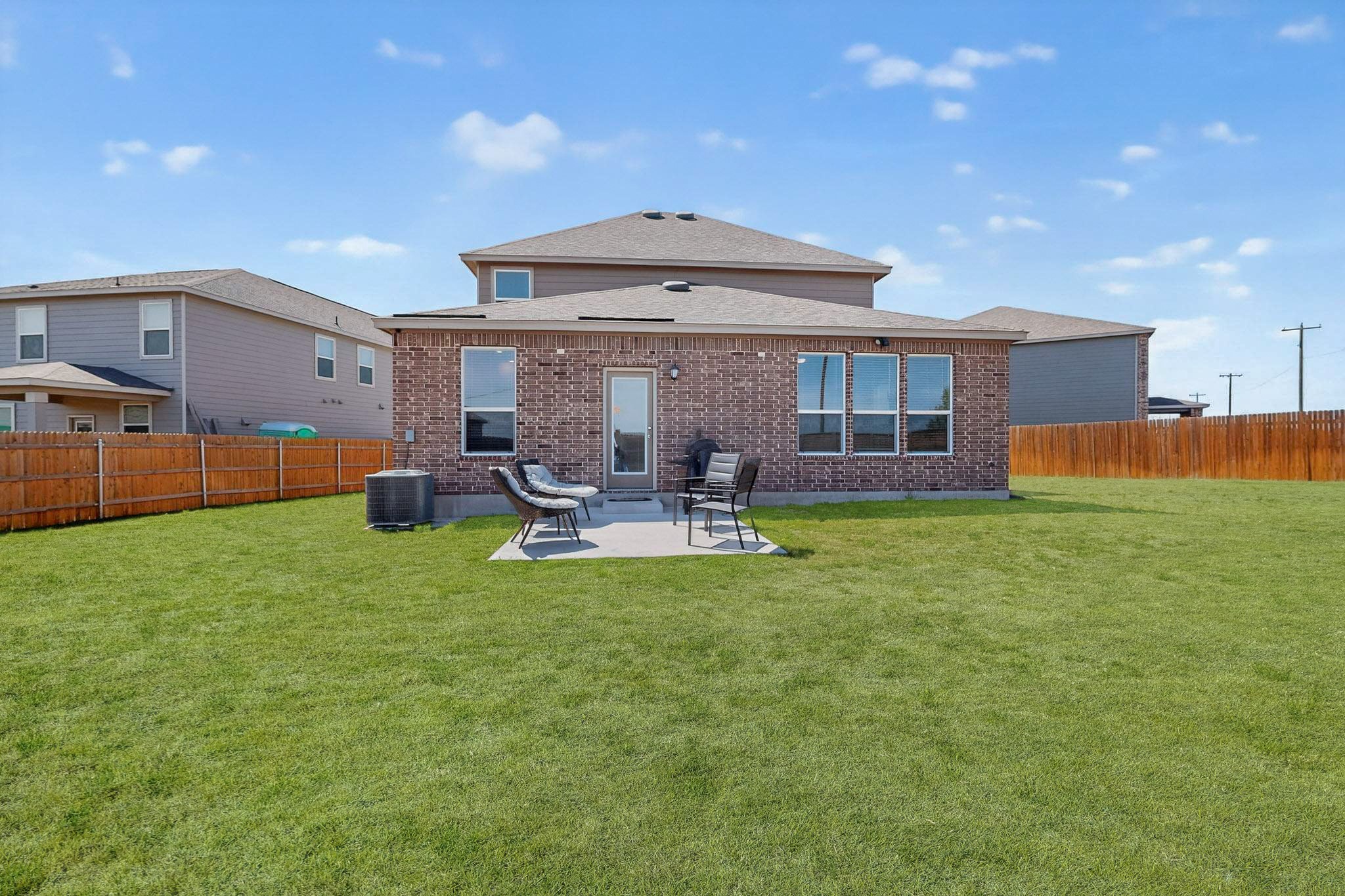 14513 Booted Eagle Pass Elgin, TX 78621 - Photo 30 of 33 Spacious backyard with plenty of room to customize, play, or create your ideal outdoor setup.