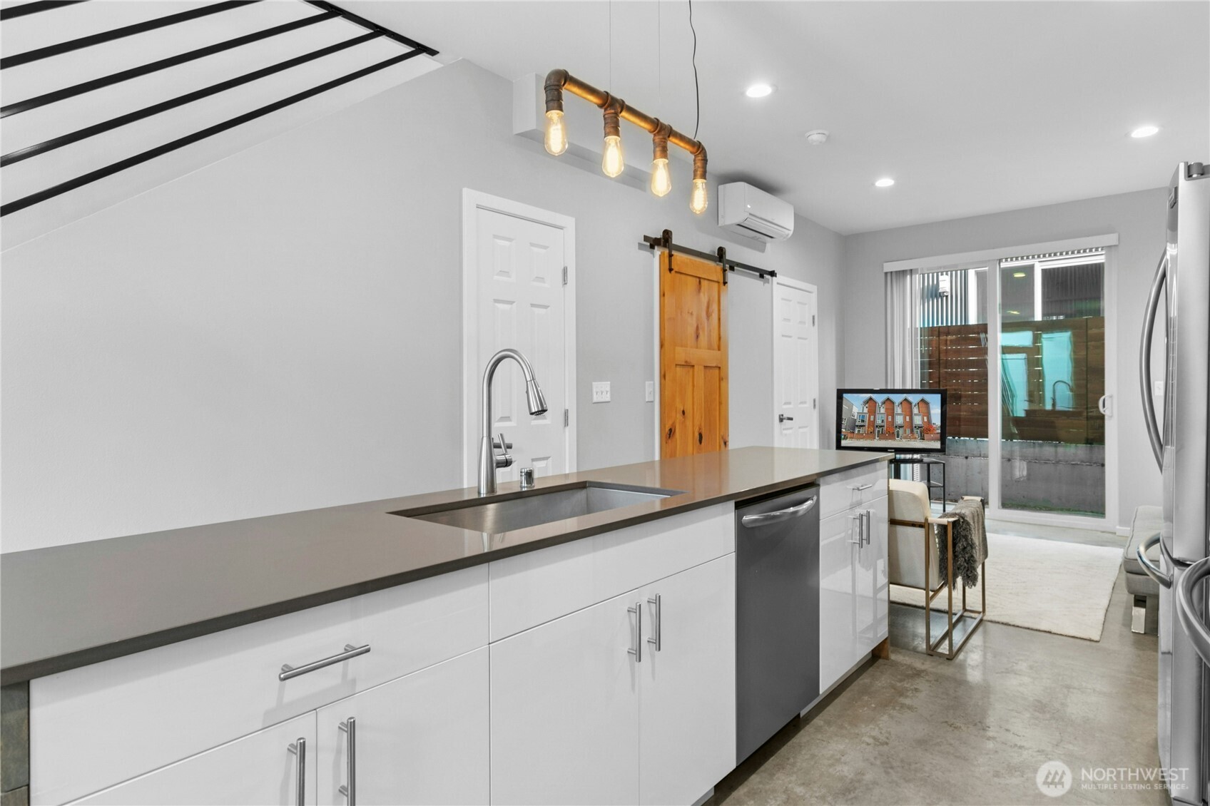 6641 Carleton Avenue South, Unit B Seattle, WA 98108 - Photo 13 of 33 a kitchen with stainless steel appliances granite countertop a sink and cabinets