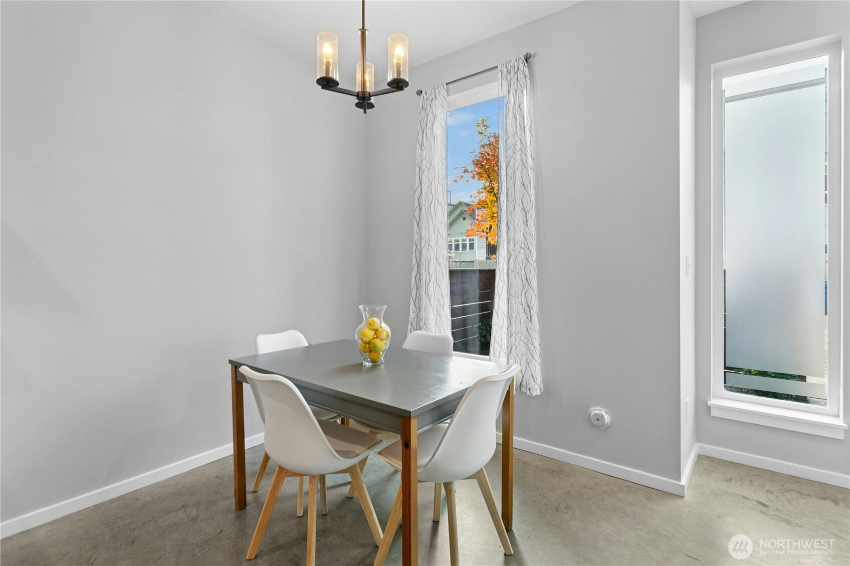 6641 Carleton Avenue South, Unit B Seattle, WA 98108 - Photo 14 of 33 a view of a dining room with a table and chairs