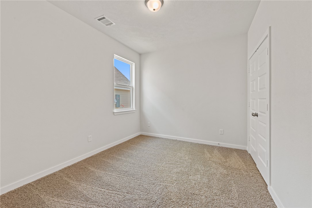 2412 Rooke Road Bryan, TX 77807 - Photo 29 of 35 a view of an empty room with windows