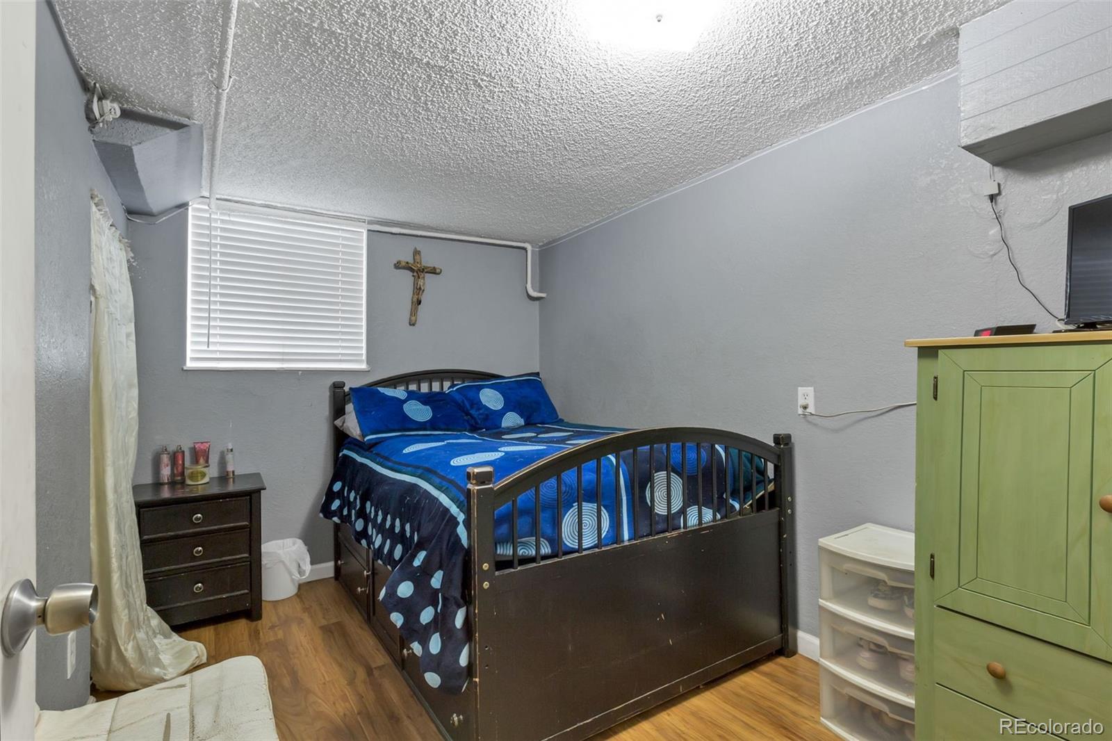 326 South Alcott Street Denver, CO 80219 - Photo 16 of 21 a bedroom with a bed and furniture