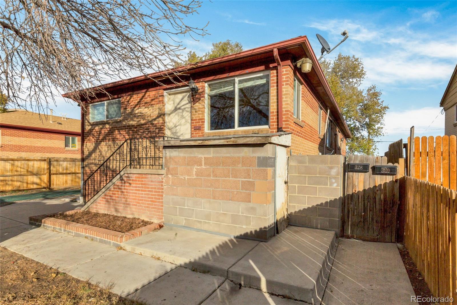 326 South Alcott Street Denver, CO 80219 - Photo 3 of 21 a view of a house with a snow on the wall