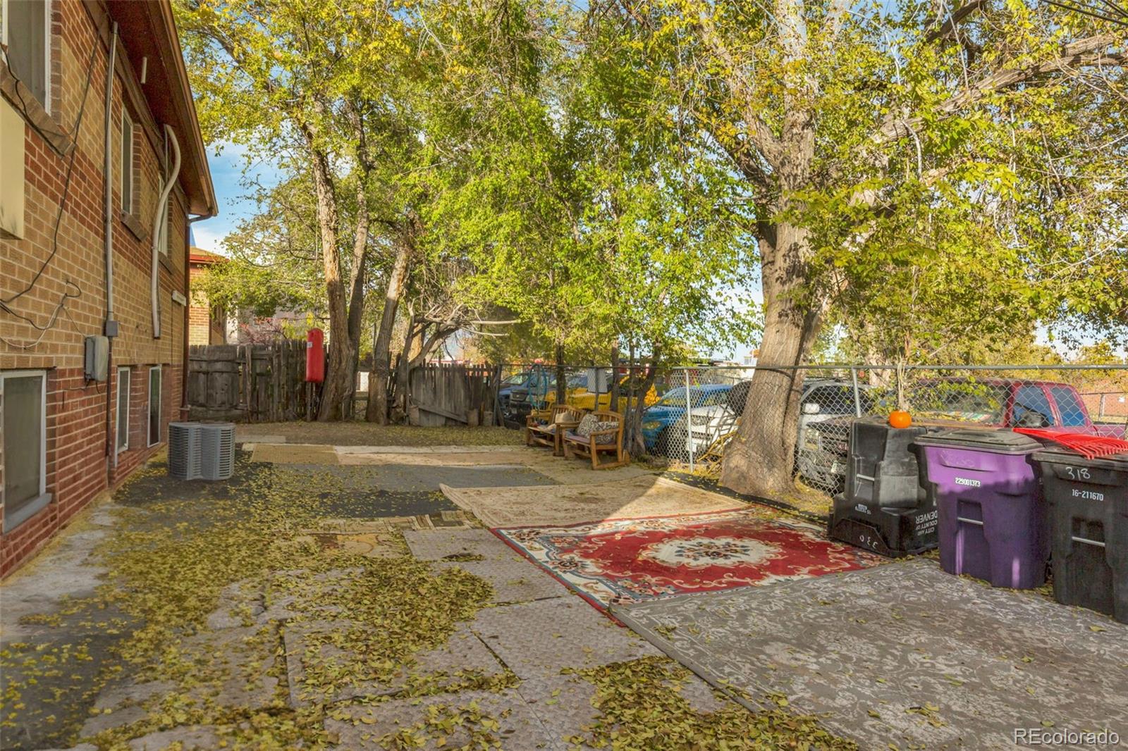 326 South Alcott Street Denver, CO 80219 - Photo 4 of 21 a view of road with large trees