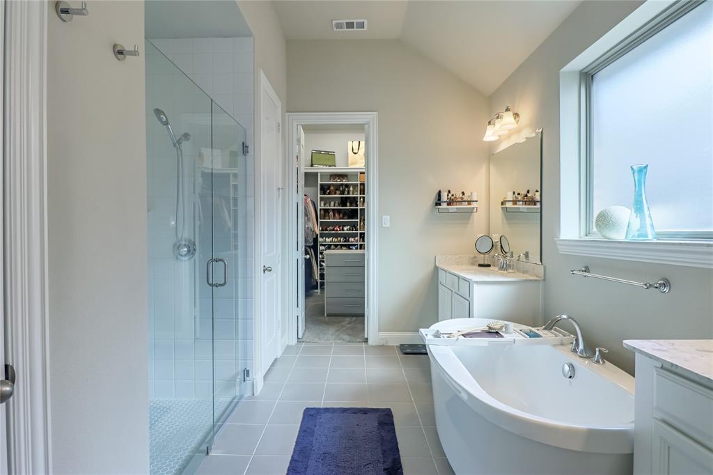 2400 Mill Pl Road Mansfield, TX 76063 - Photo 18 of 32 a spacious bathroom with a bathtub shower sink mirror and toilet