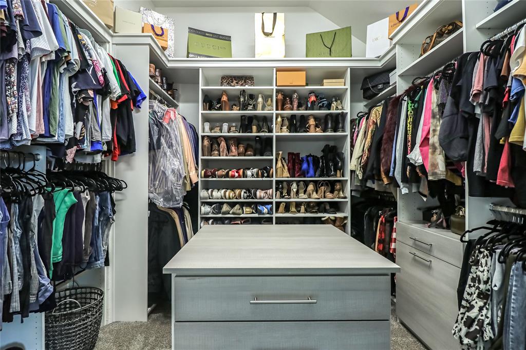 2400 Mill Pl Road Mansfield, TX 76063 - Photo 19 of 32 a view of walk in closet with clothes and shoes