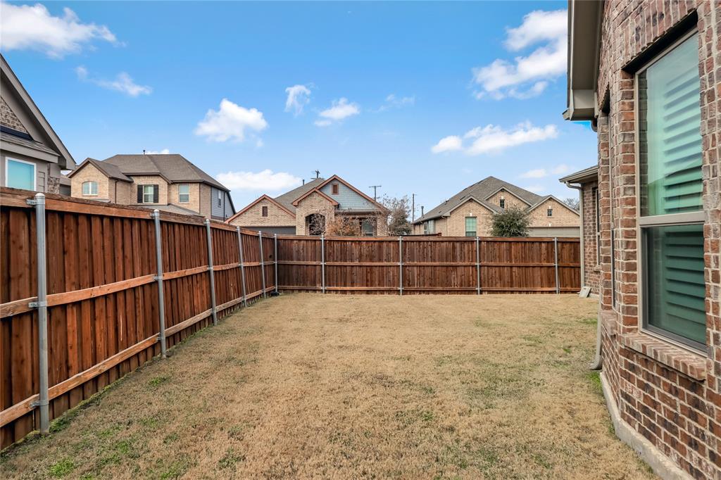 2400 Mill Pl Road Mansfield, TX 76063 - Photo 29 of 32 a view of wooden fence and a yard
