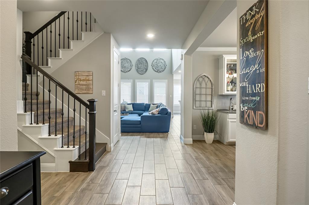 2400 Mill Pl Road Mansfield, TX 76063 - Photo 5 of 32 a view of a hallway with wooden floor and furniture