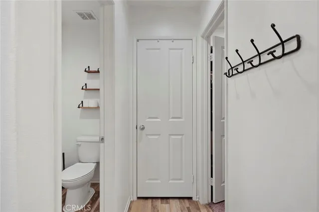 a bathroom with a granite countertop toilet and a shower