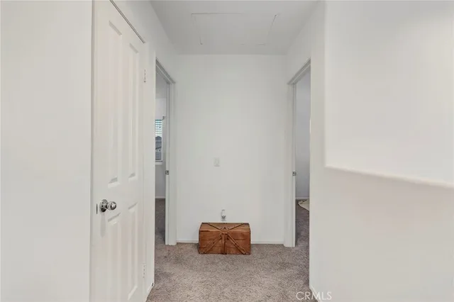 a room with a mirror and a window