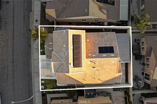 an aerial view of a residential apartment building with a yard