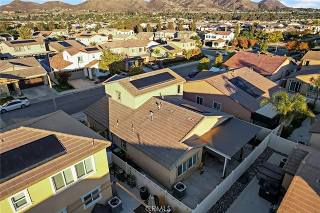 an aerial view of residential houses with outdoor space