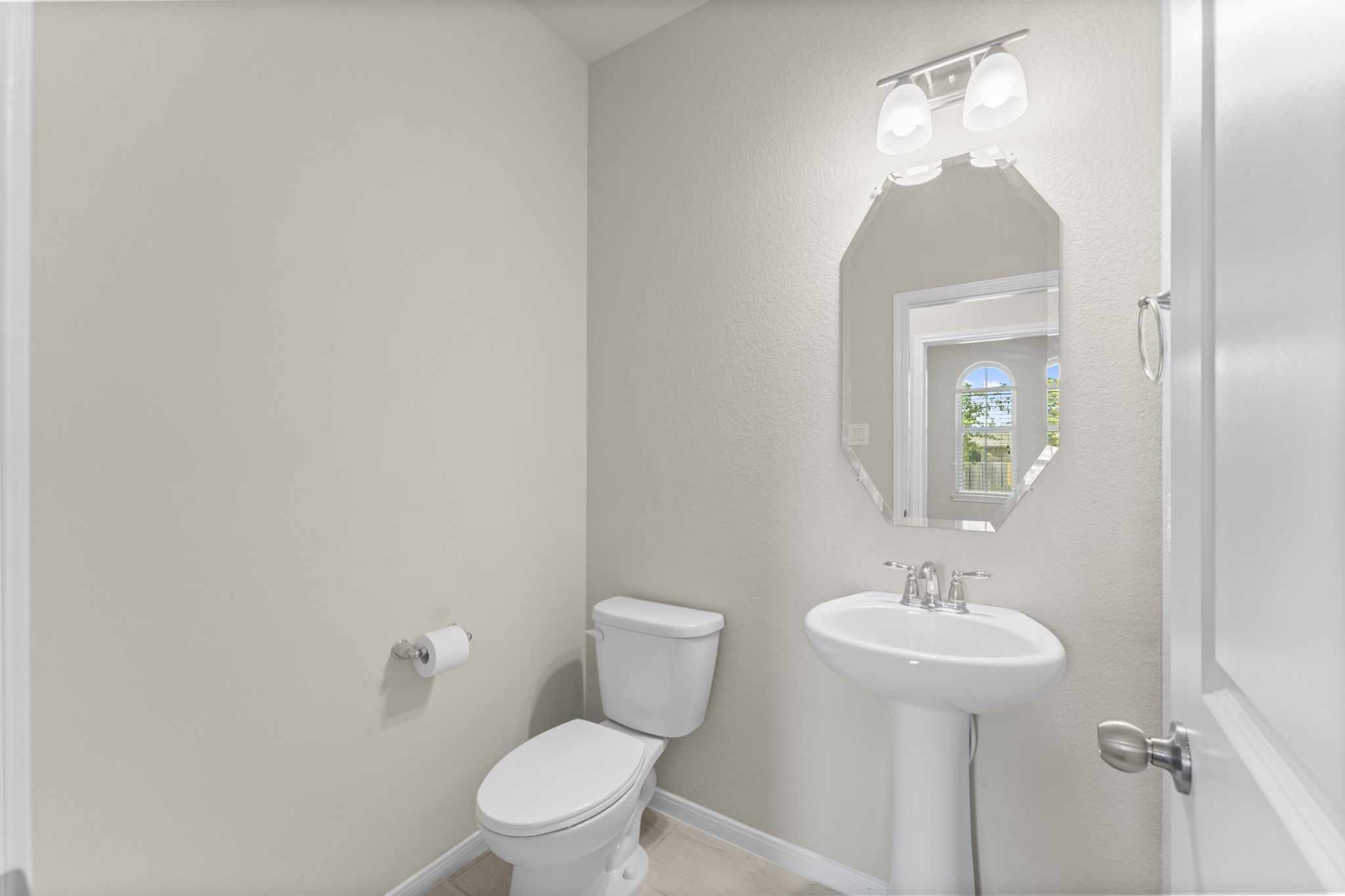 5015 Gold Lantana Trail Spring, TX 77389 - Photo 11 of 50 a bathroom with a toilet sink and mirror
