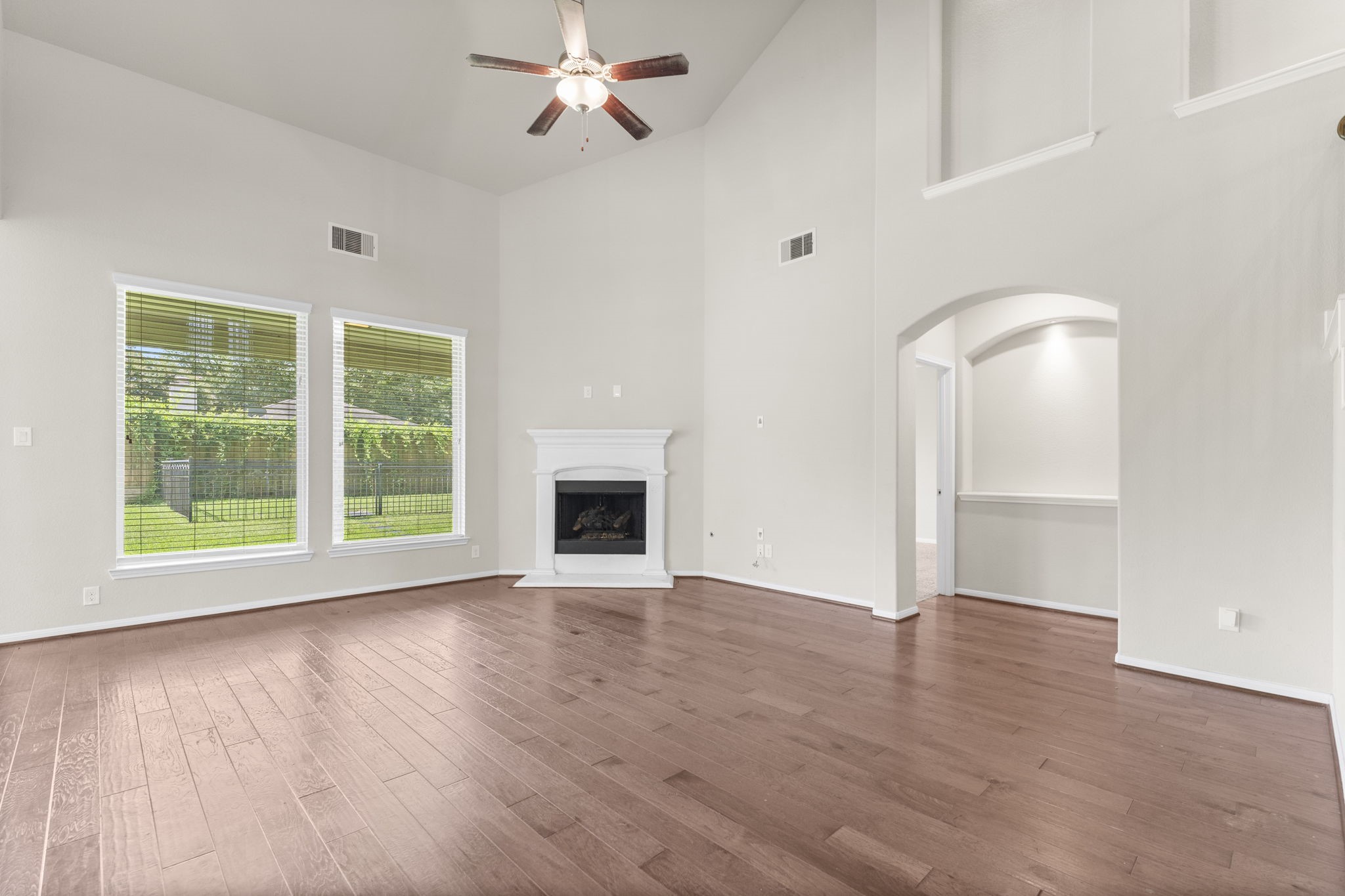 5015 Gold Lantana Trail Spring, TX 77389 - Photo 14 of 50 a view of an empty room with wooden floor and a window