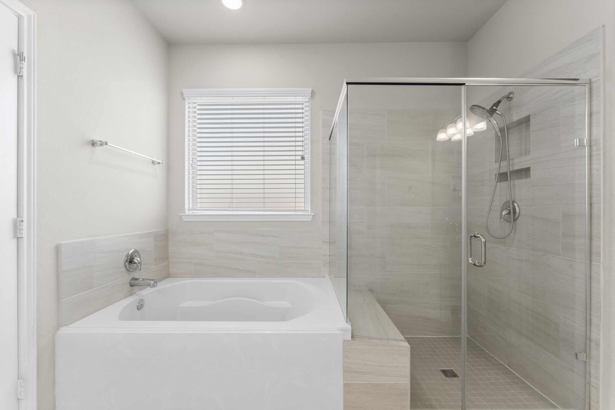 5015 Gold Lantana Trail Spring, TX 77389 - Photo 28 of 50 a white bath tub sitting next to a white sink and a shower