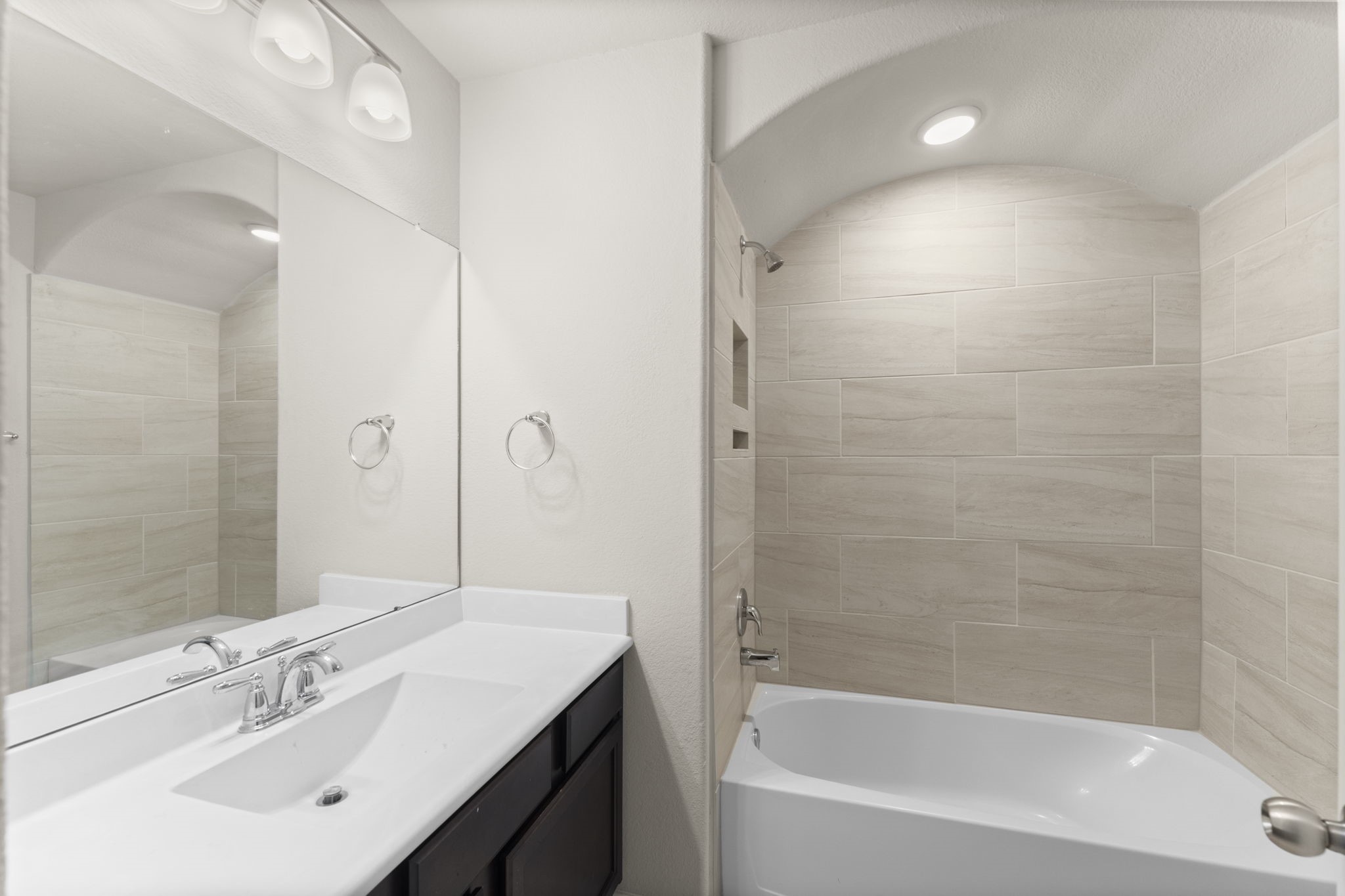 5015 Gold Lantana Trail Spring, TX 77389 - Photo 36 of 50 a bathroom with a bathtub shower sink vanity and a mirror