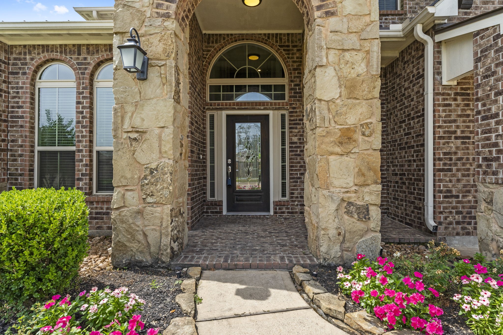 5015 Gold Lantana Trail Spring, TX 77389 - Photo 4 of 50 a front view of a house with an outdoor space