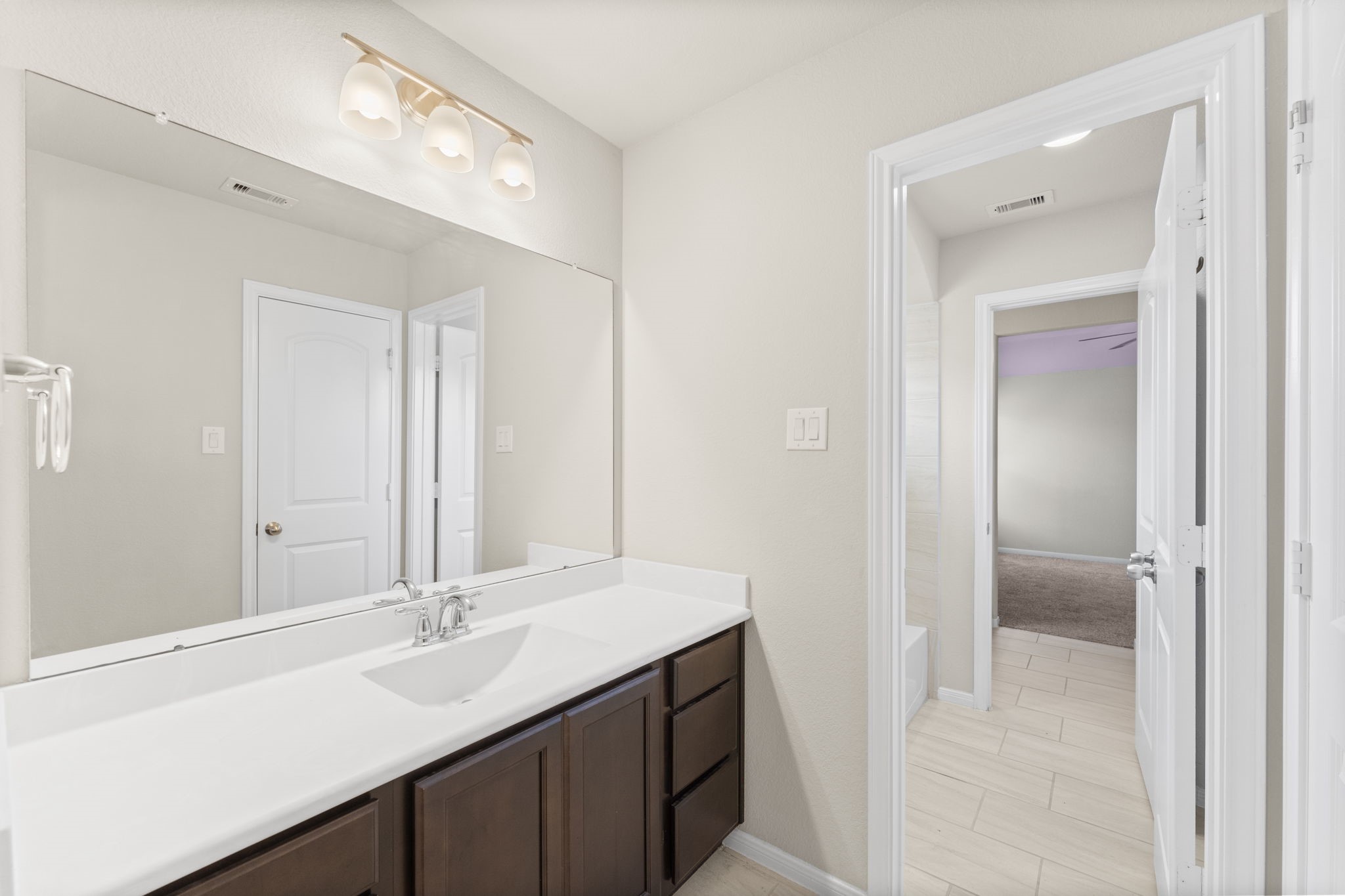 5015 Gold Lantana Trail Spring, TX 77389 - Photo 41 of 50 a bathroom with a double vanity sink mirror and