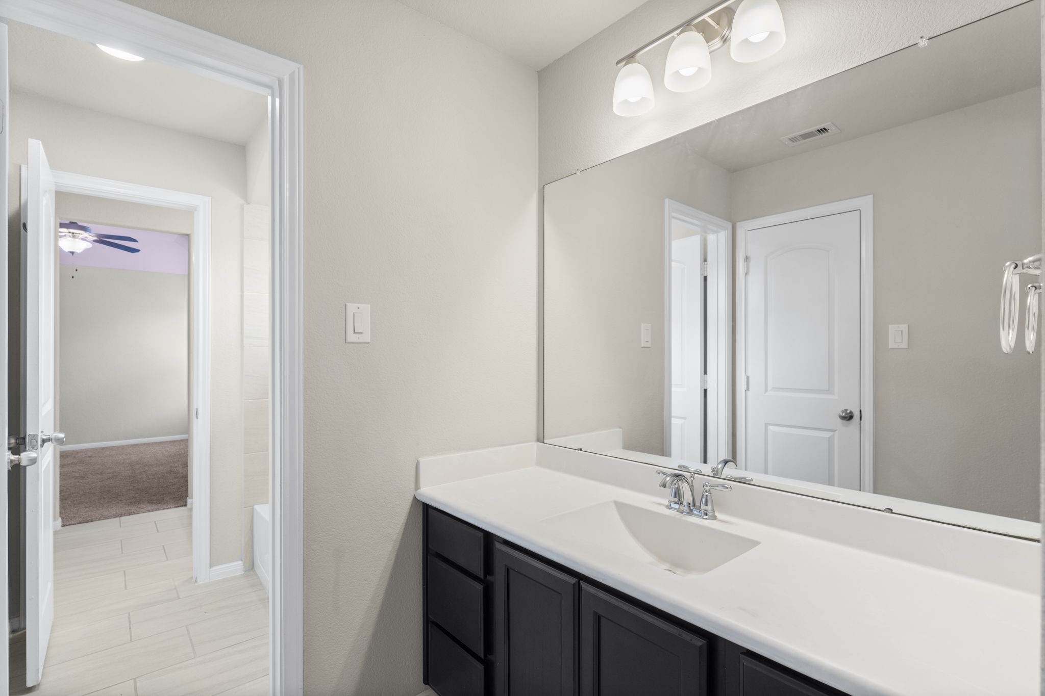 5015 Gold Lantana Trail Spring, TX 77389 - Photo 43 of 50 a bathroom with a double vanity sink and a mirror