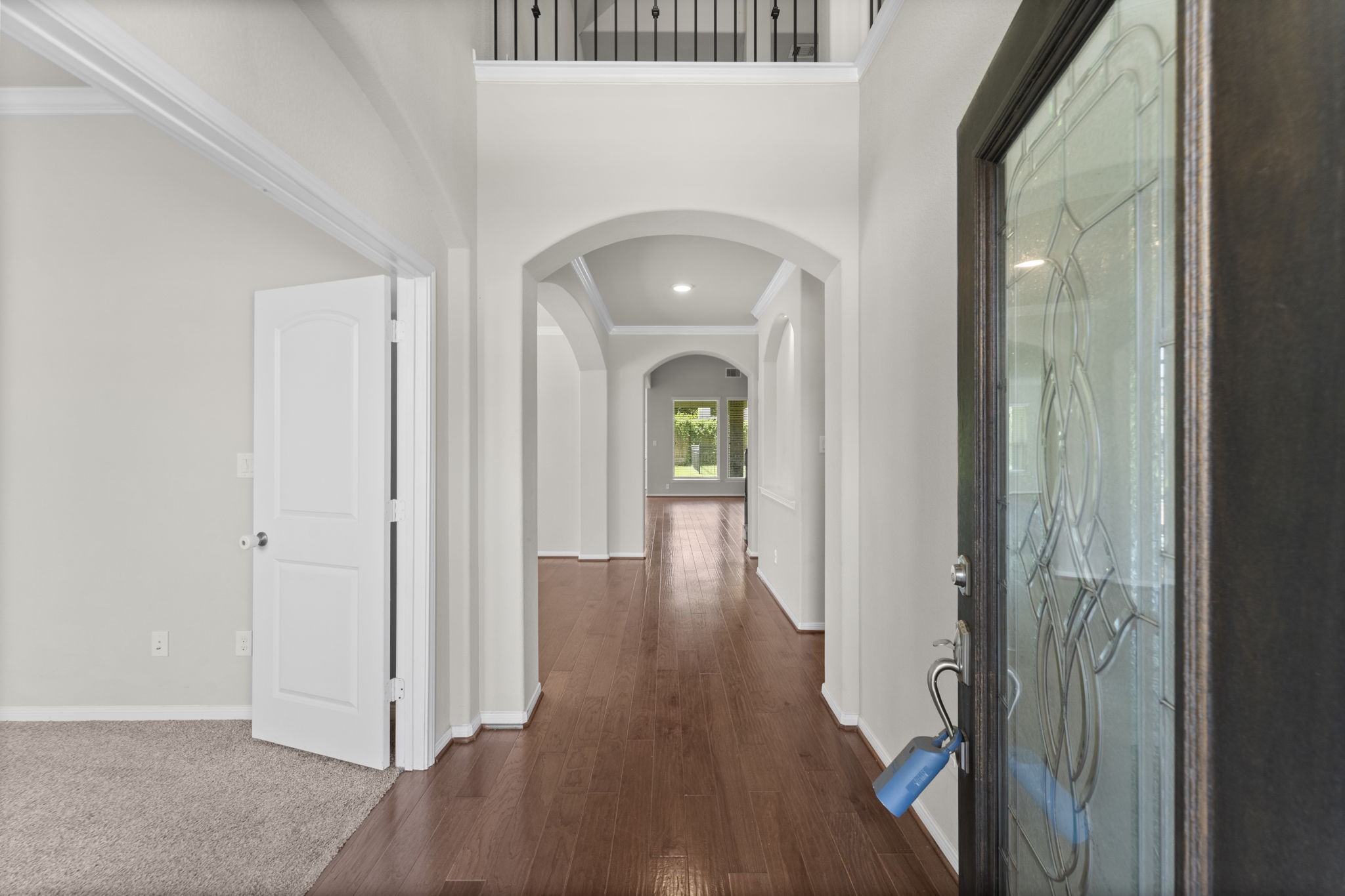 5015 Gold Lantana Trail Spring, TX 77389 - Photo 6 of 50 wooden floor in an empty room with a mirror
