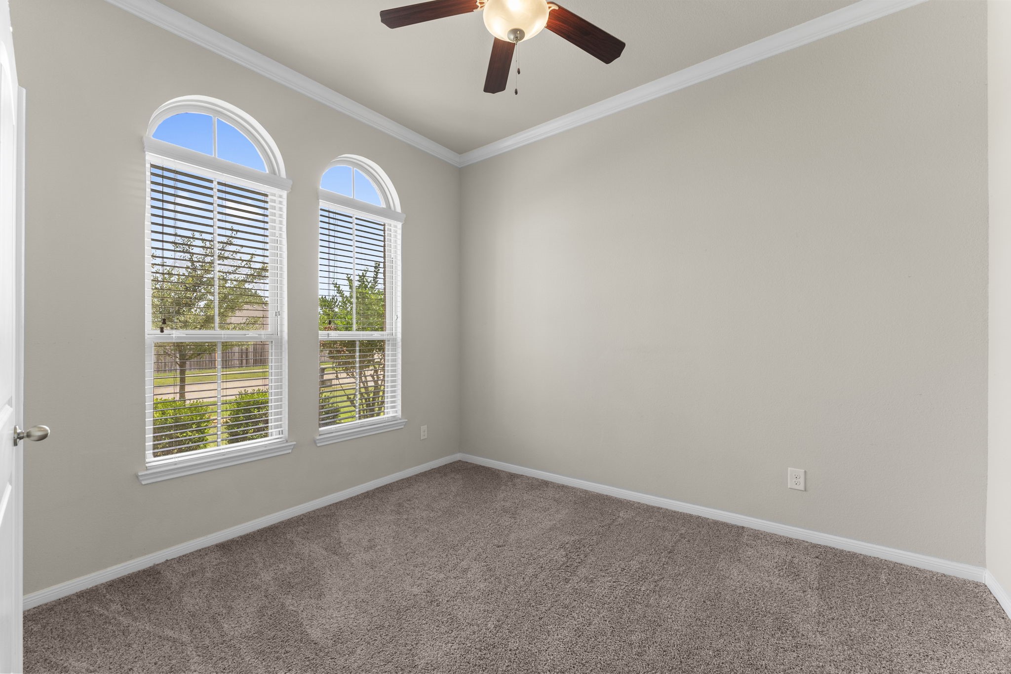 5015 Gold Lantana Trail Spring, TX 77389 - Photo 8 of 50 an empty room with a window and a ceiling fan