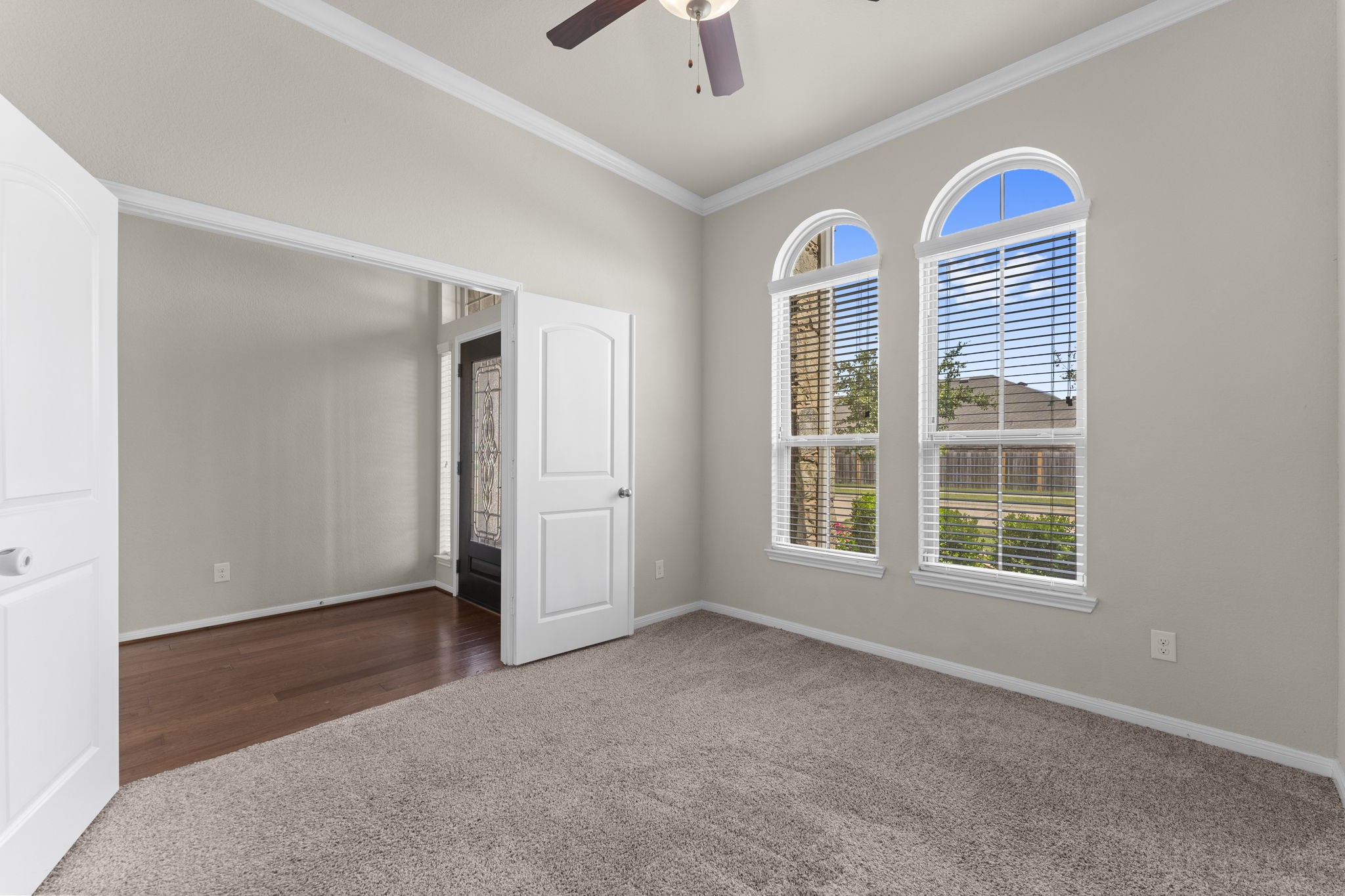 5015 Gold Lantana Trail Spring, TX 77389 - Photo 9 of 50 an empty room with windows and chandelier fan