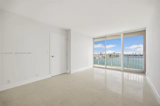 a view of an empty room and window